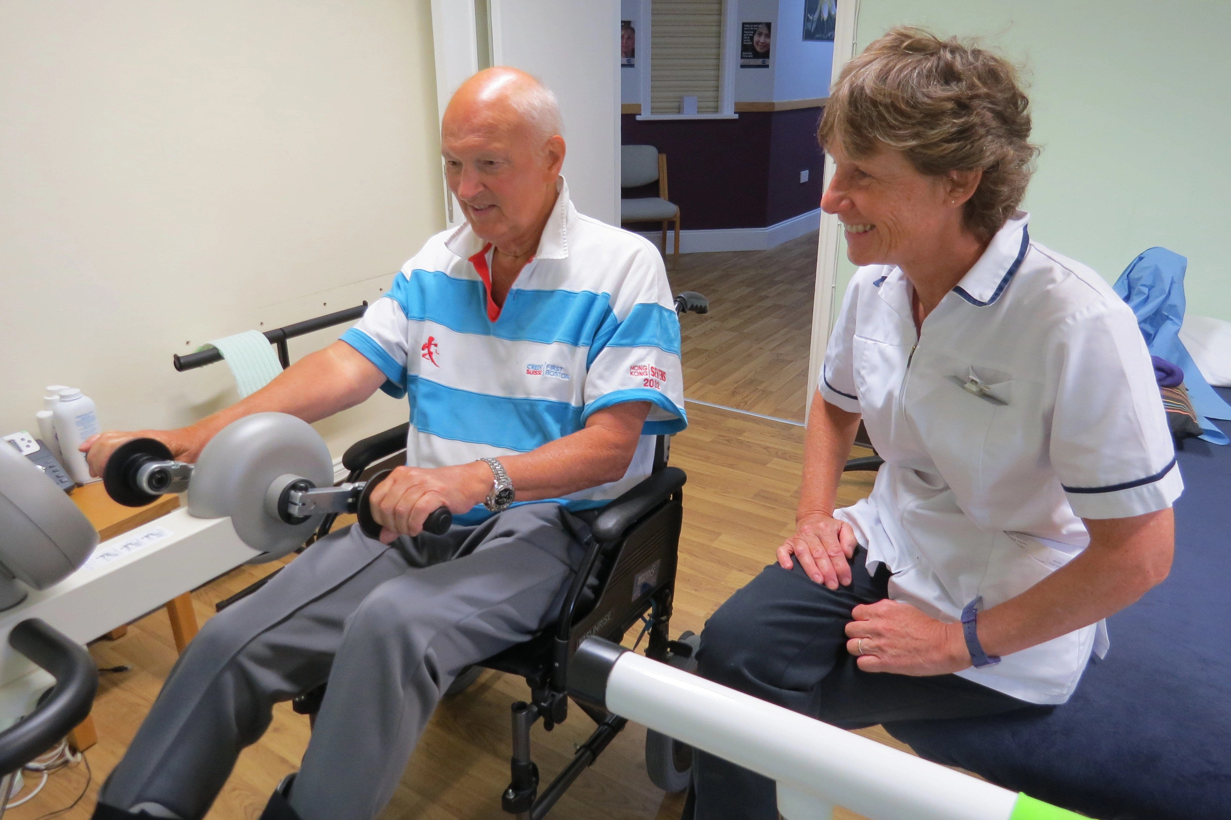 Patient using a hand bike for physiotherpy