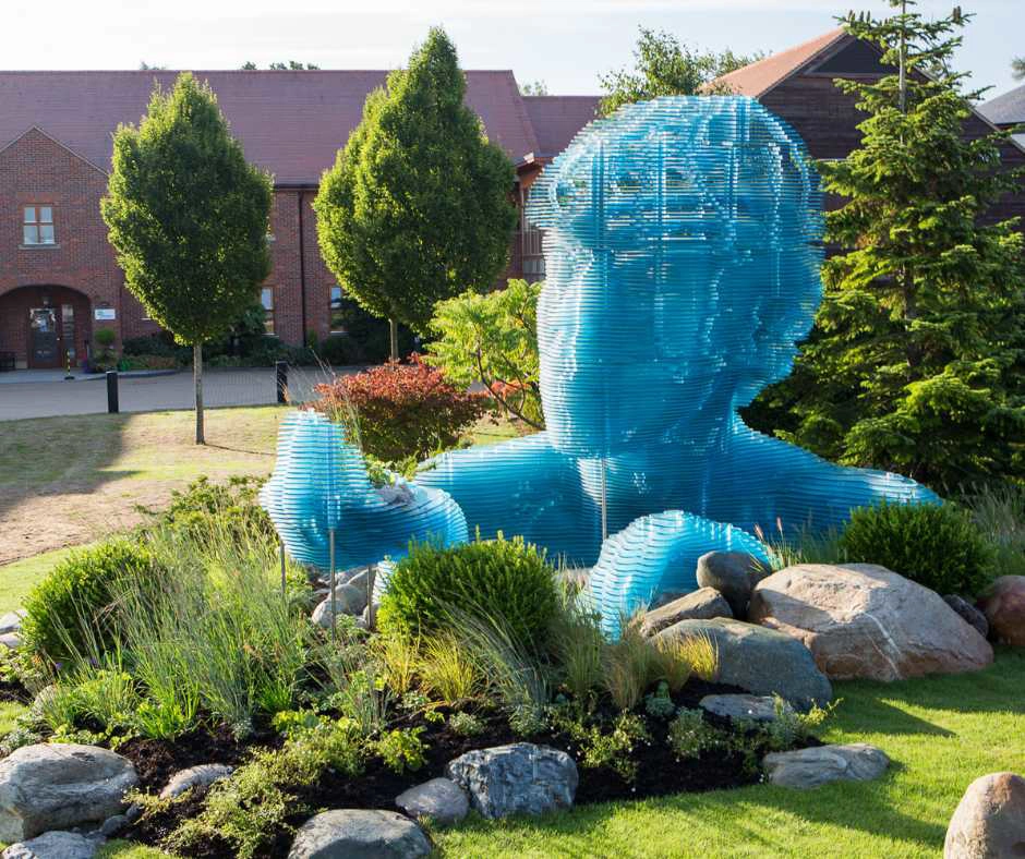 Image of the front of The Hospice of St Francis and the statue